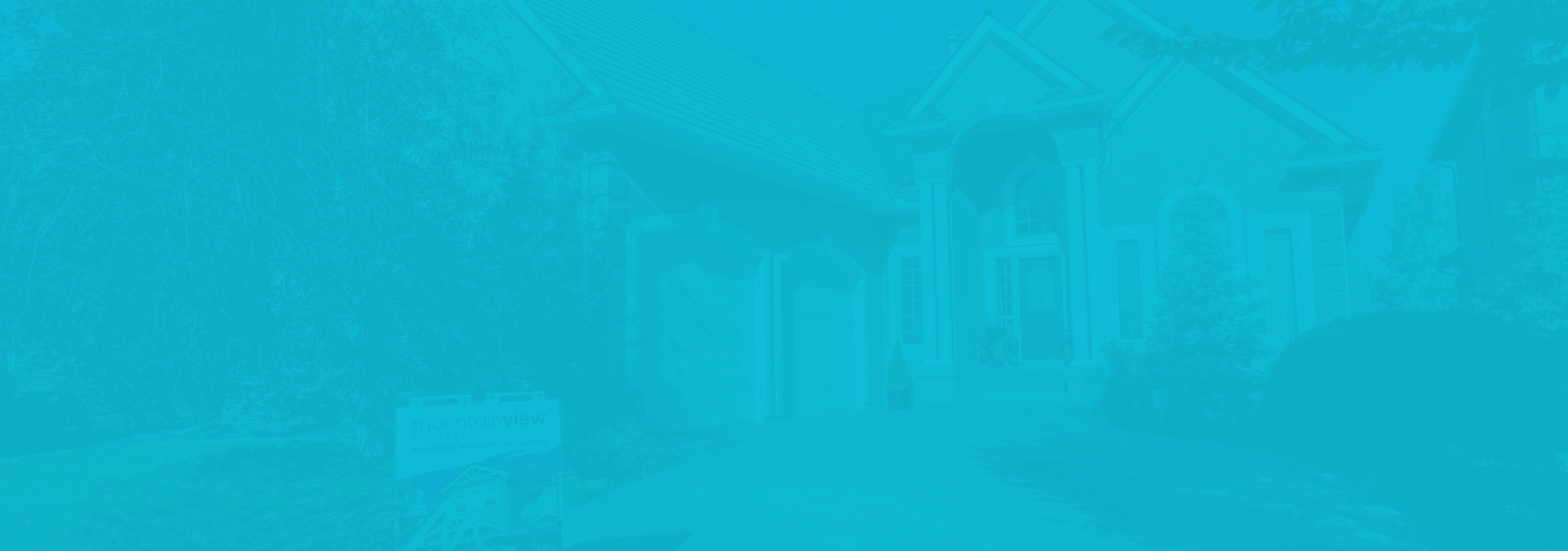 A blue background with a house that was recently painted by Mountain View Painters